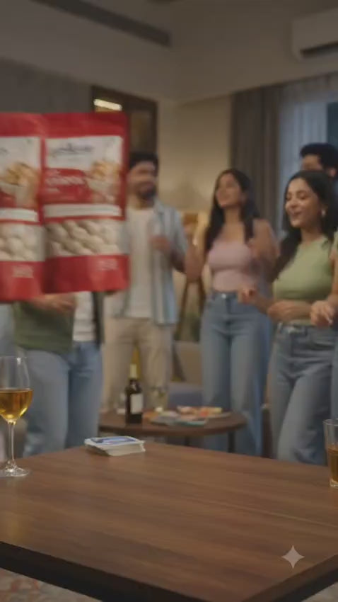 Lifestyle video showing friends sharing and enjoying PopKhana roasted makhana snacks during a party gathering.